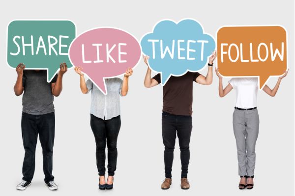 diverse set of people with social boards in front of their face